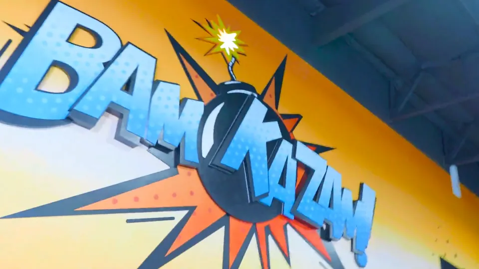 Player dodging obstacles in a Bam Kazam game room