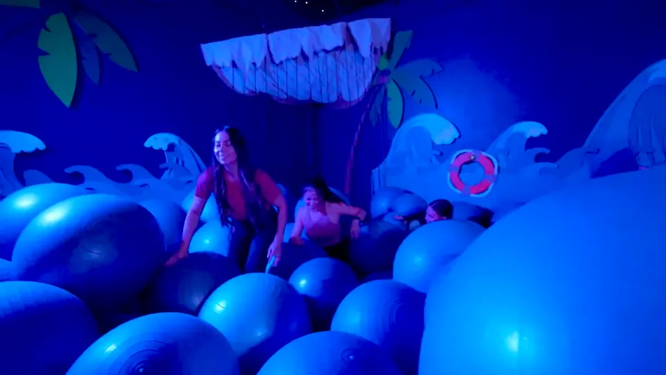 Players celebrating inside a Bam Kazam game room